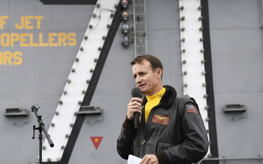 Capt. Brett Crozier, commanding officer of the aircraft carrier USS Theodore Roosevelt, addresses the crew during an all-hands call on the ship's flight deck on Nov. 14, 2019.