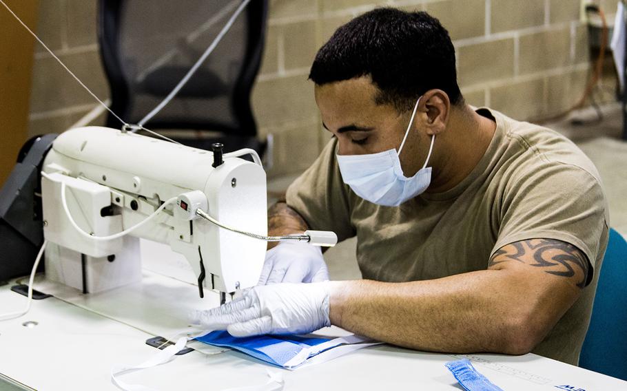 A parachute rigger with 1st Special Forces Group (Airborne), Group Support Battalion sews surgical masks for medical patients at Joint Base Lewis-McChord, Wash., on March 31, 2020. 