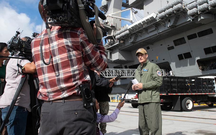 Capt. Brett Crozier speaks to reporters in front of the USS Theodore Roosevelt at Naval Air Station North Island, San Diego, Jan. 17, 2020. 
