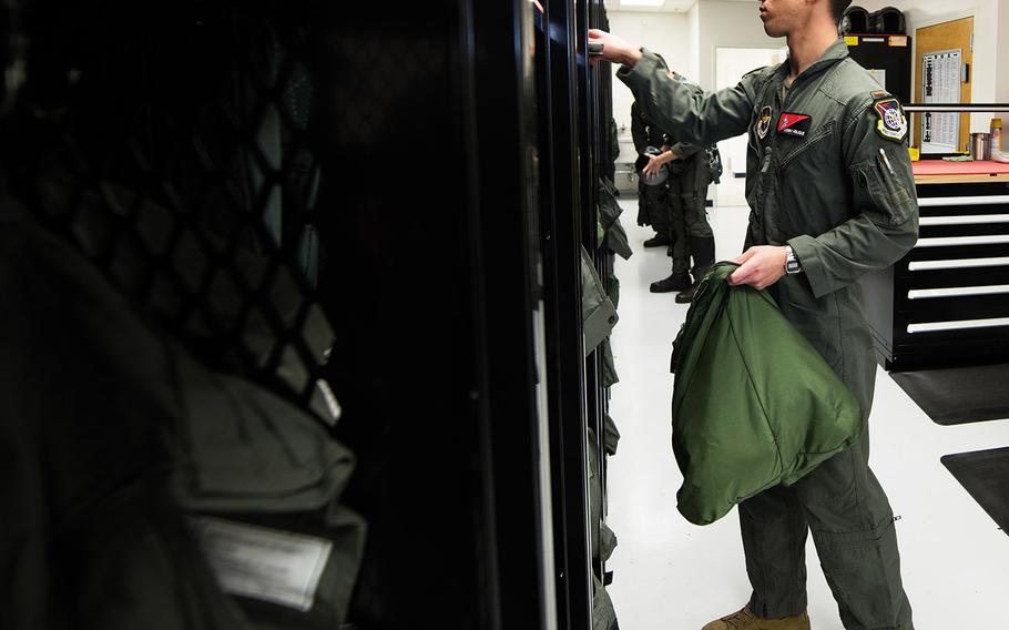 U.S. Air Force 2nd Lt. Andrew Molique, Detachment 24 student pilot, puts on his gear before his solo flight during the Pilot Training Next program March 5, 2020, at Joint Base San Antonio-Randolph, Texas. The PTN program is part of Air Education and Training Command's initiative to "reimagine" how learning is delivered to airmen.