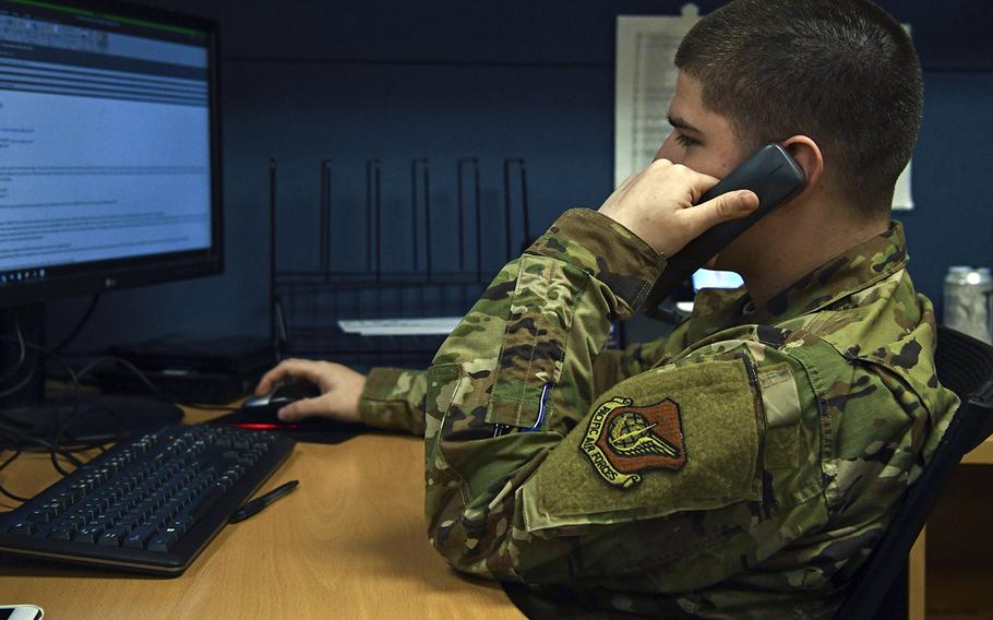 Staff Sgt. Juan Lobo, 8th Force Support Squadron Military Personnel Flight outbound assignments technician, assists a customer at Kunsan Air Base, Republic of Korea, Apr. 6, 2020.