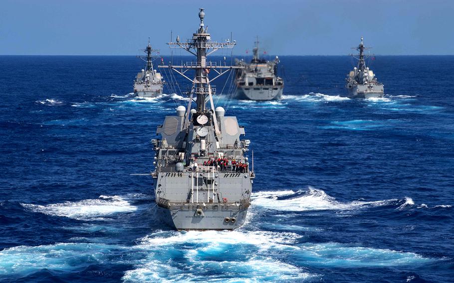 In a Sept. 7, 2019 photo, the guided-missile destroyer USS Gravely, left, the fast combat support ship USNS Supply, front center, the guided-missile destroyer USS Forrest Sherman, right, and the guided-missile destroyer USS Winston S. Churchill conduct a refueling-at-sea in the Atlantic Ocean.