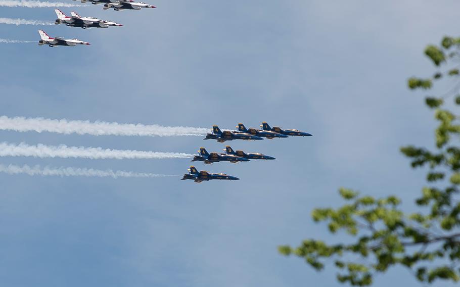 F/A-18 Hornets with the Navy's Blue Angels followed by F-16 Fighting Falcons with the Air Force's Thunderbirds wrap up an aerial demonstration as they depart  Washington, D.C. on Saturday, May 2, 2020.