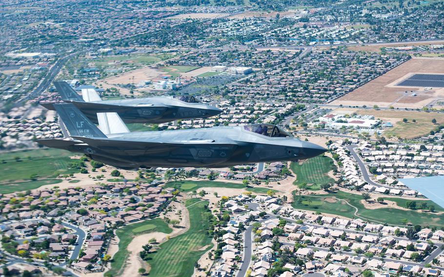 Two F-35A Lightning II fighter jets from Luke Air Force Base fly in formation during the Air Force Salutes flyover on Friday May 1, 2020, over Arizona.