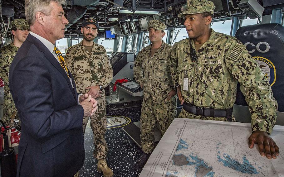 In a May 9, 2018 photo, U.S. Ambassador to Norway Kenneth J. Braithwaite speaks with sailors in the pilothouse of the guided-missile destroyer USS Farragut during a tour of the ship at Bodo, Norway.