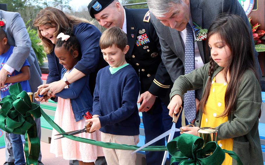 Department of Defense Education Activity director Thomas Brady, right, helps open the new Pierce Terrace Elementary School for Fort Jackson, S.C., Feb. 12, 2020. 