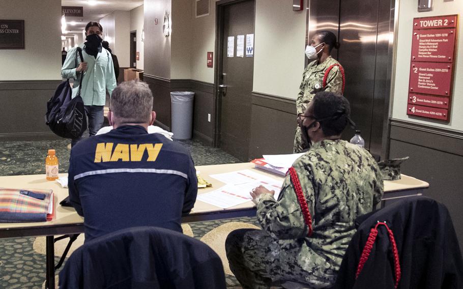 Recruit Training Command staff check in new recruits at an off-base facility for a 14-day Restriction Of Movement prior to the recruits beginning their official in-processing for basic training.