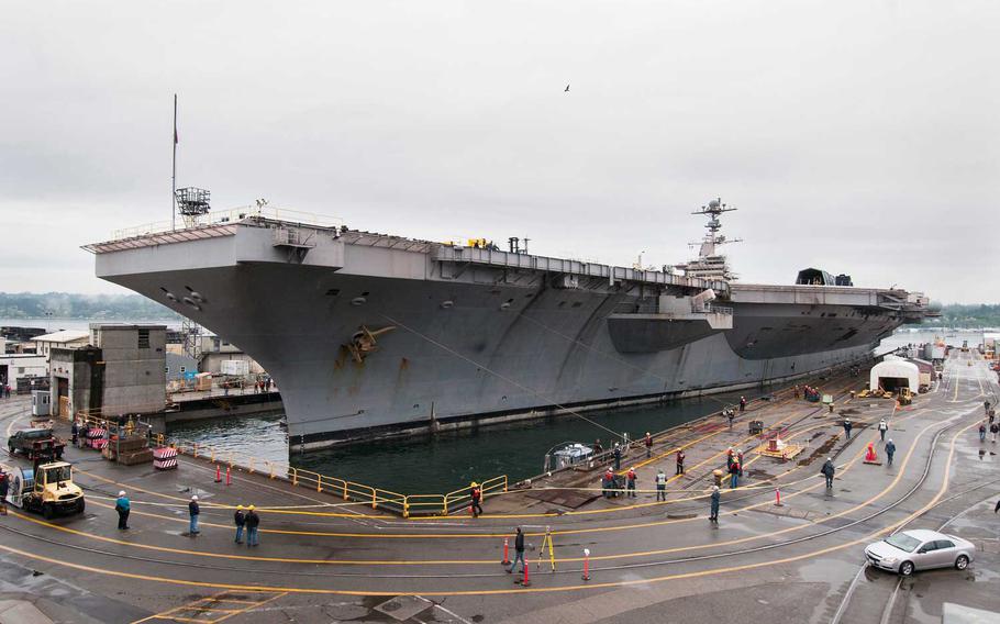The Nimitz-class aircraft carrier USS John C. Stennis (CVN 74) enters dry dock at the Puget Sound Naval Dockyard and Intermediate Maintenance Facility to begin a scheduled gradual docking availability.  The dry dock will allow sailors and shipyard workers to access the vessel below the waterline for maintenance, repairs and overhauls. 
