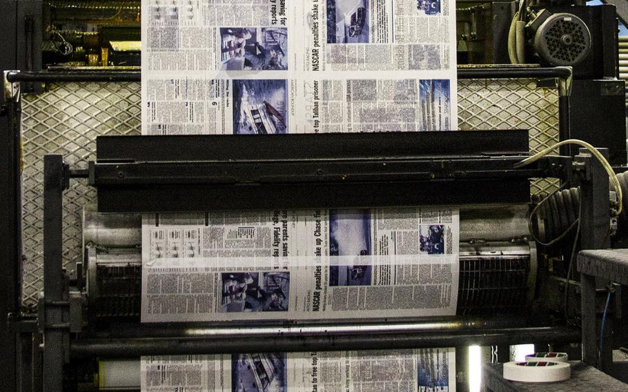 An edition of Stars and Stripes rolls through the press at a printing plant in the Middle East.