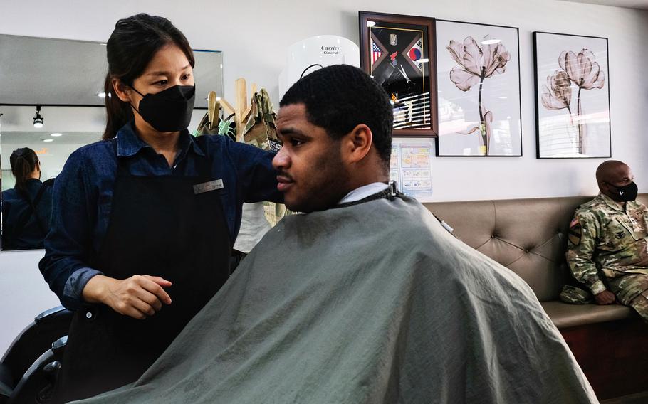 Sgt. Ervin Dunston gets a haircut off base for the first time in months at a barbershop outside Camp Humphreys, South Korea, on Wednesday, May 20, 2020.
