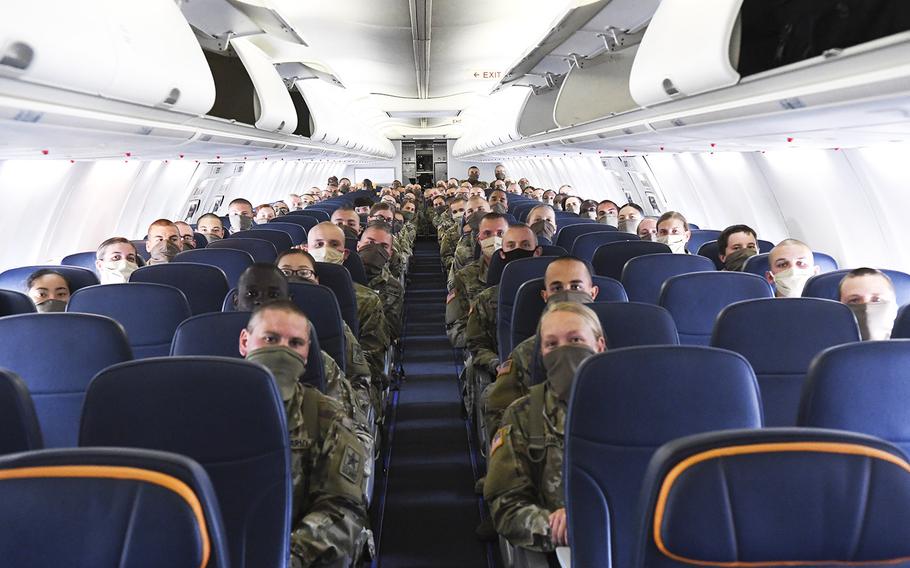 Initial Entry Training soldiers wait on board their chartered aircraft to depart Columbia Metropolitan Airport in Columbia, S.C. for Fort Sam Houston, Texas, May 8, 2020.