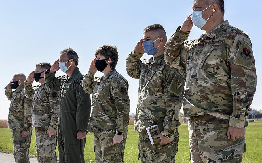 Members of the Ohio National Guard and 180th Fighter Wing command staffs salute as U.S. Air Force Gen. Joseph Lengyel, Chief of the National Guard Bureau, leaves the 180th Fighter Wing in Swanton, Ohio, May 6, 2020.