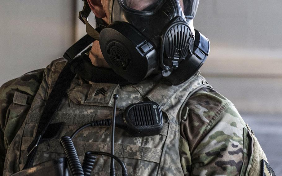 A Minnesota National Guard soldier is on the alert during a security mission alongside local law enforcement under State Highway 55 in Minneapolis on Friday, May 29, 2020.