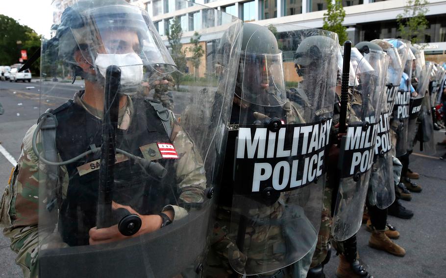 Police clear the area around Lafayette Park and the White House as demonstrators gather to protest the death of George Floyd, Monday, June 1, 2020, in Washington. Floyd died after being restrained by Minneapolis police officers.