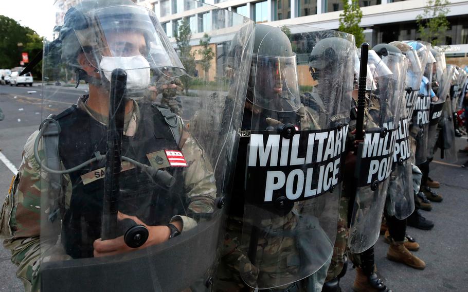 Police clear the area around Lafayette Park and the White House as demonstrators gather to protest the death of George Floyd, Monday, June 1, 2020, in Washington. 