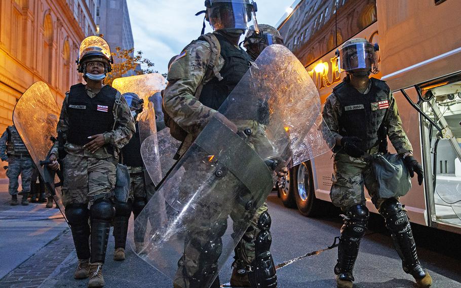 Members of the National Guard load a bus before leaving an area near the White Hosue where demonstrators gather to protest the death of George Floyd, Wednesday, June 3, 2020, in Washington.