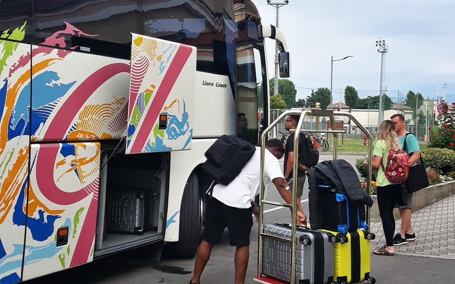 In a July, 2019 photo, soldiers and families PCS-ing from USAG Italy load their luggage onto the shuttle bus to Marco Polo International Airport.
