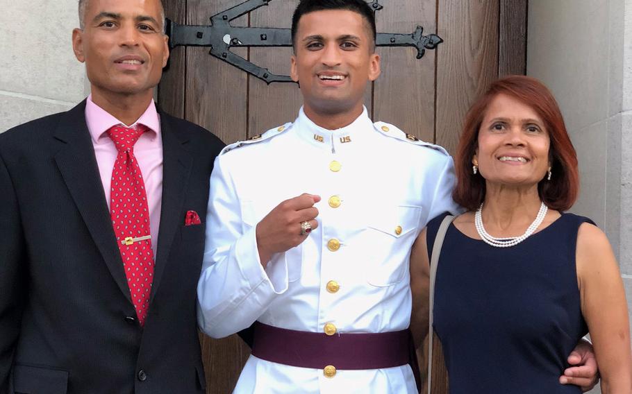 Chandra and Indu Mundra with their son Anant Mundra during a previous visit to the U.S. Military Academy at West Point, N.Y. Anant Mundra will graduate from the academy Saturday in a virtual ceremony. While his parents can’t attend in person, they said they are proud and intend to watch all related events from their home in California.