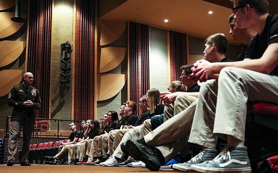 In a February, 2020 photo, Command Sgt. Maj. of the Army Reserve Ted L. Copeland talks with Army recruits in Wapakoneta, Ohio, his hometown.