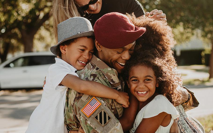 "Daddy! Daddy" yell the McKenzie kids as they reunite with Lt. Col. Simon McKenzie after his 2020 deployment to Quatar.