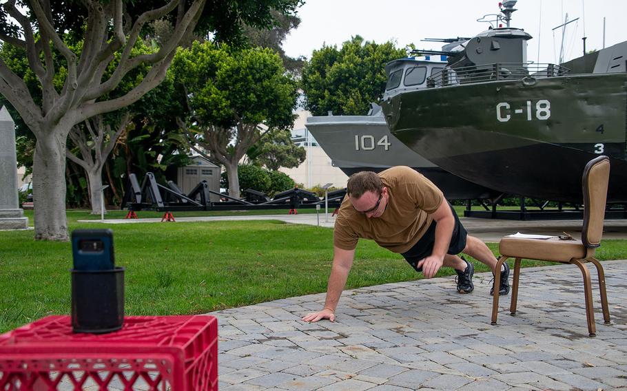 A sailor uses video conferencing to lead a virtual physical training session from Coronado, Calif., May 1, 2020.