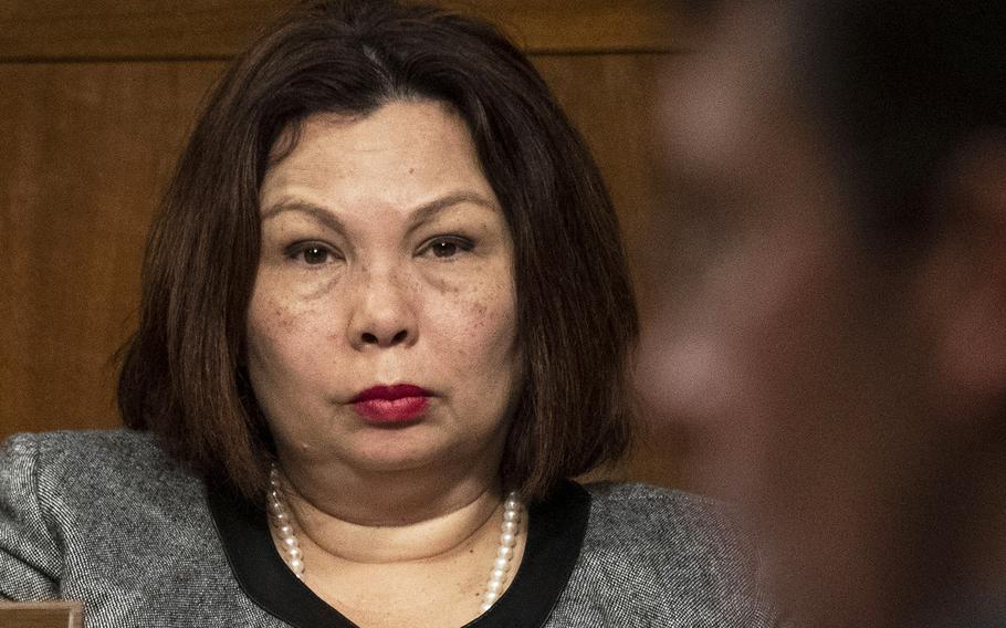 Sen. Tammy Duckworth, D-Ill., listens to Mark Esper's testimony during his Secretary of Defense confirmation hearing on Capitol Hill in July, 2019.
