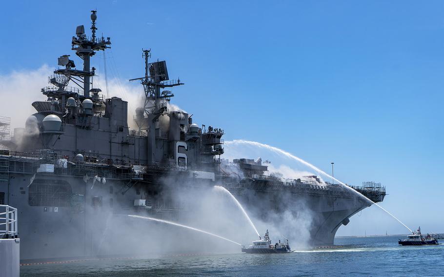 Port of San Diego Harbor Police Department boats combat a fire on board USS Bonhomme Richard at Naval Base San Diego, July 12, 2020.