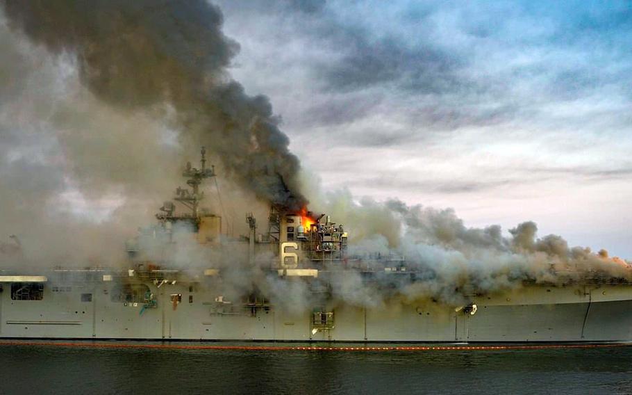 Firefighters battle a blaze on board the amphibious assault ship USS Bonhomme Richard at Naval Base San Diego, Sunday, July 12, 2020. 