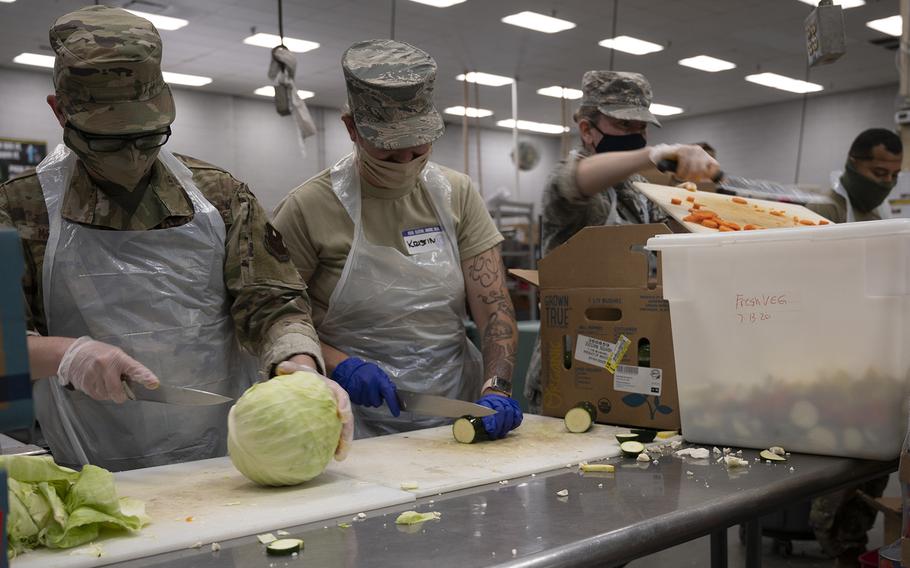 Arizona National Guard service members help prepare meals July 6, 2020 at Saint Vincent de Paul's rescue mission in Phoenix for local homeless. The assistance is part of the Arizona National Guard's multifaceted response to community needs during this COVID19 state of emergency.