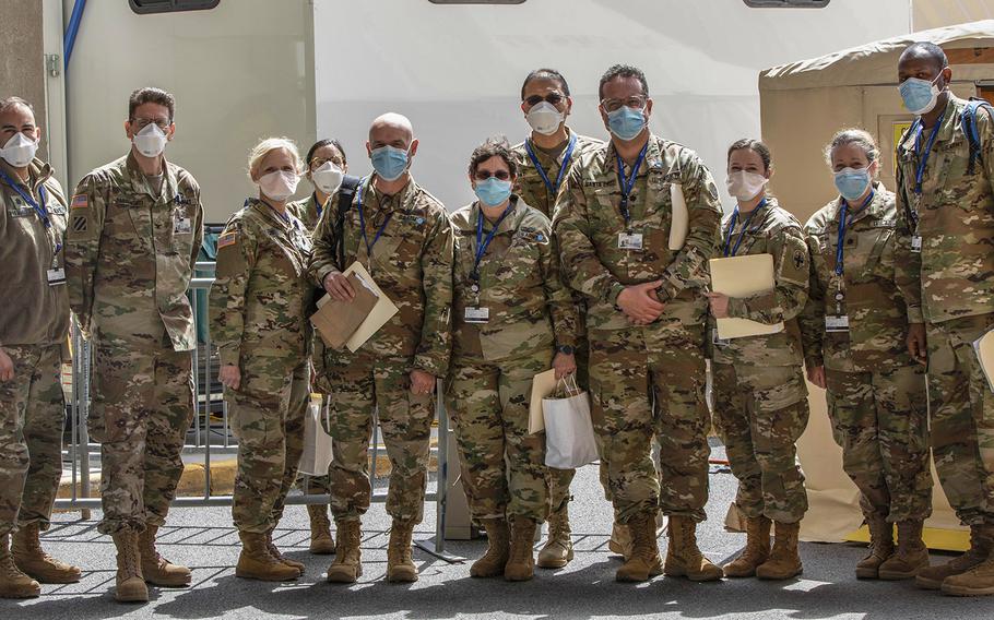 In an April 14, 2020 photo, soldiers with the U.S. Army's Urban Augmentation Medical Task Force 332-1, 332nd Medical Brigade pose at University Hospital, Newark, N.J.