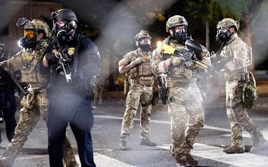 Federal agents disperse Black Lives Matter protesters near the Mark O. Hatfield United States Courthouse on Monday, July 20, 2020, in Portland, Ore.