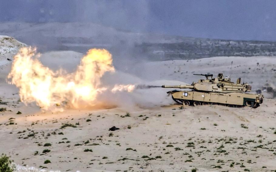 In a January, 2018 photo, an M1 Abrams tank from 2nd Brigade Combat Team, 1st Armored Division, Fort Bliss, Texas fires a 120mm round during a live fire exercise at Iron Union 18-6 in the United Arab Emirates.