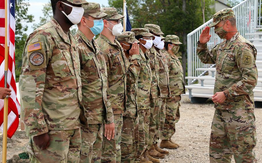In a July 27, 2020 photo, Gen. Joseph M. Martin, Vice Chief of Staff of the U.S. Army, leads a reenlistment ceremony of Michigan National Guardsmen during the Northern Strike 2020 exercise at the Grayling Maneuver Training Center, in Grayling, Mich.