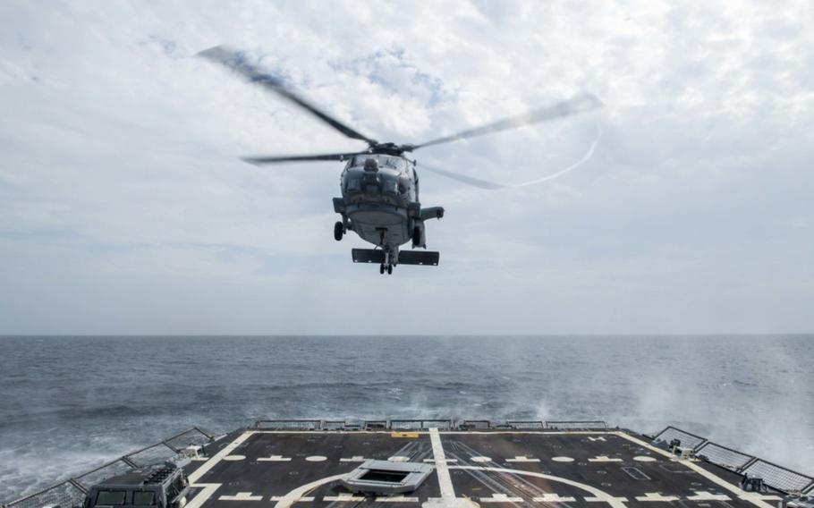An MH-60R Sea Hawk helicopter assigned to the "Grandmasters" of Helicopter Maritime Strike Squadron 46 takes off from Arleigh Burke-class guided-missile destroyer USS Thomas Hudner's flight deck Aug. 2, 2020. Hudner is operating in the Atlantic Ocean in support of naval operations to maintain maritime stability and security in order to ensure access, deter aggression and defend U.S., allied and partner interests. 