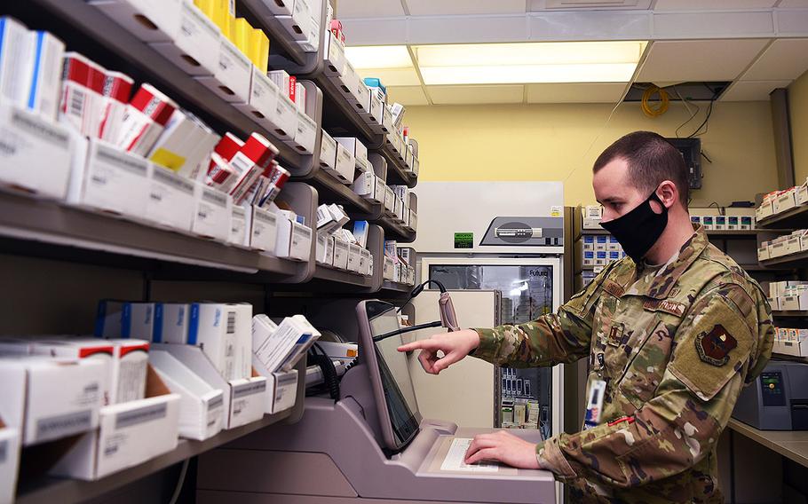 U.S. Air Force Capt. Adam Remme, 17th Medical Group pharmacy element chief, mandates prescription refills during preparations for the Ross Clinic pharmacy's curbside reinstatement on Goodfellow Air Force Base, Texas, May 6, 2020.