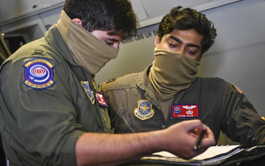 9th Air Refueling Squadron KC-10 Extender pilots review a pre-flight checklist June 17, 2020, at Travis Air Force Base, Calif.