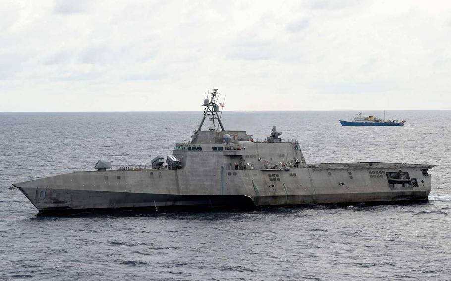 The Independence-variant littoral combat ship USS Gabrielle Giffords (LCS 10), left, conducts routine operations in the vicinity of the Chinese vessel Hai Yang Di Zhi 4 Hao, July 1, 2020.