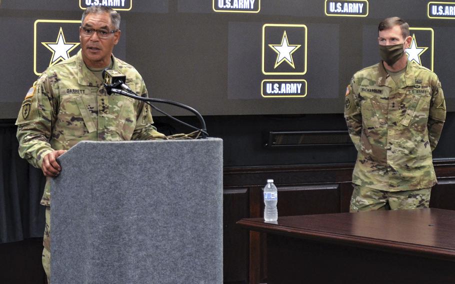 Gen. Michael Garrett, commander of Army Forces Command, addresses concerns about trust in leadership at Fort Hood as the new acting base commander Maj. Gen. John Richardson looks on during a news conference Wednesday at Fort Hood, Texas.