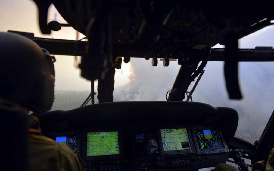 Oregon Army National Guard Black Hawk Pilot in command CWO4 Joe Zeiner, from G/1-189 Aviation (MEDEVAC) out of Salem, Ore., approaches a giant smoke plume in flight for aerial water drop operations in eastern, Oregon, Aug. 22, 2020.