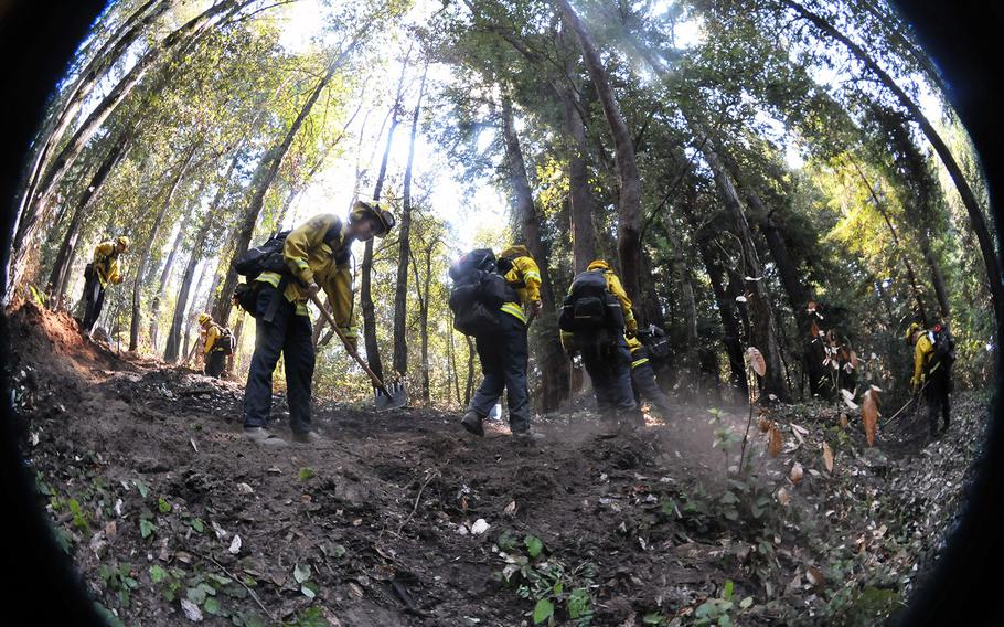 Bravo team from the California Army National Guard’s Task Force Rattlesnake out of Redding, Calif., create a defensive fire line Sept. 1, 2020, at Bonny Doon, Santa Cruz County, during the CZU Lightning Complex Fire in Santa Cruz and San Mateo counties.