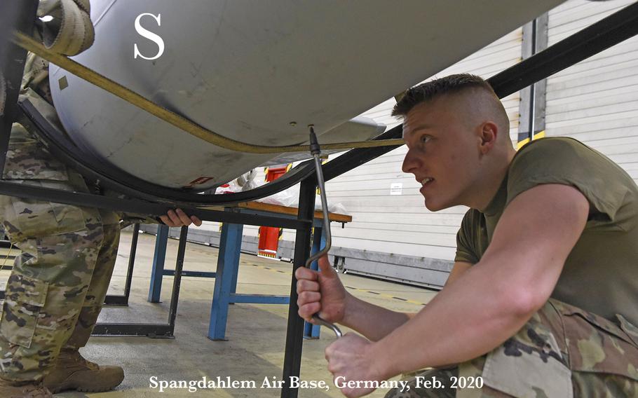 U.S. Air Force Senior Airman Tanner Sterner, 52nd Maintenance Squadron aerospace propulsion journeyman, assists with taking apart a fuel tank during a nestable fuel-tank build up familiarization event at Spangdahlem Air Base, Germany, Feb. 24, 2020. The event allowed augmentees to work outside of their career field and learn a new side of the 52nd FW mission. 