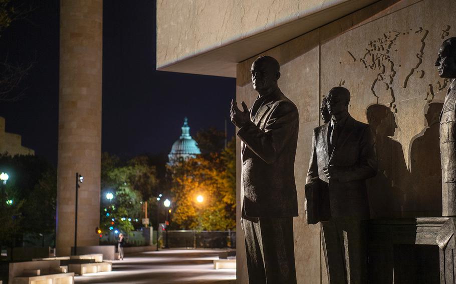 With the U.S. Capitol building seen in the distance, sculptures depicting the 34th president standing with military and civilian advisors are seen on a display at the new Dwight D. Eisenhower Memorial in Washington D.C., on Sept. 8, 2020.