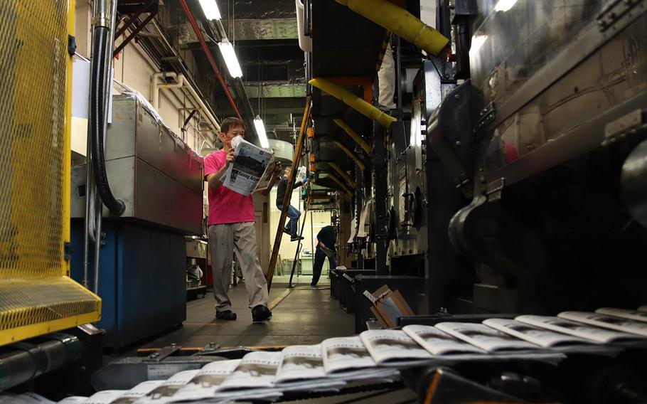 An issue of Stars and Stripes rolls off the press in central Tokyo, April 4, 2020.