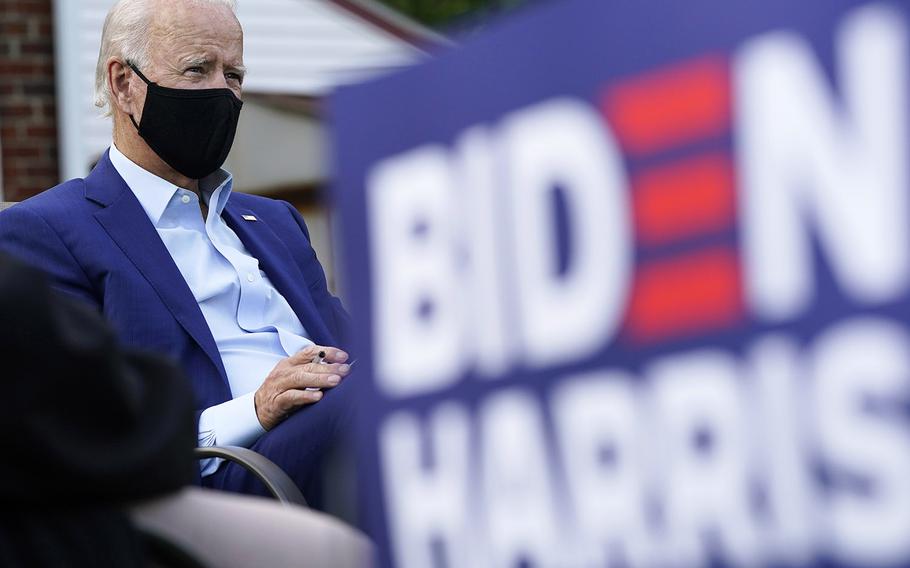 Democratic presidential candidate former Vice President Joe Biden listens during a campaign event with steelworkers in the backyard of a home in Detroit, Wednesday, Sept. 9, 2020.