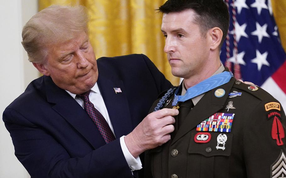 President Donald Trump awards the Medal of Honor to Army Sgt. Maj. Thomas P. Payne in the East Room of the White House on Friday, Sept. 11, 2020.