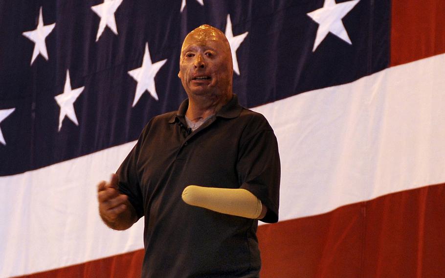 Army veteran Staff Sgt. Bobby Henline talks of his injuries and healing process before transitioning into his stand-up comedic act, while touring Offutt Air Force Base, Neb., on May 24, 2012. In a video post in September 2020, Henline is demanding people stop using his image for political propaganda purposes. 