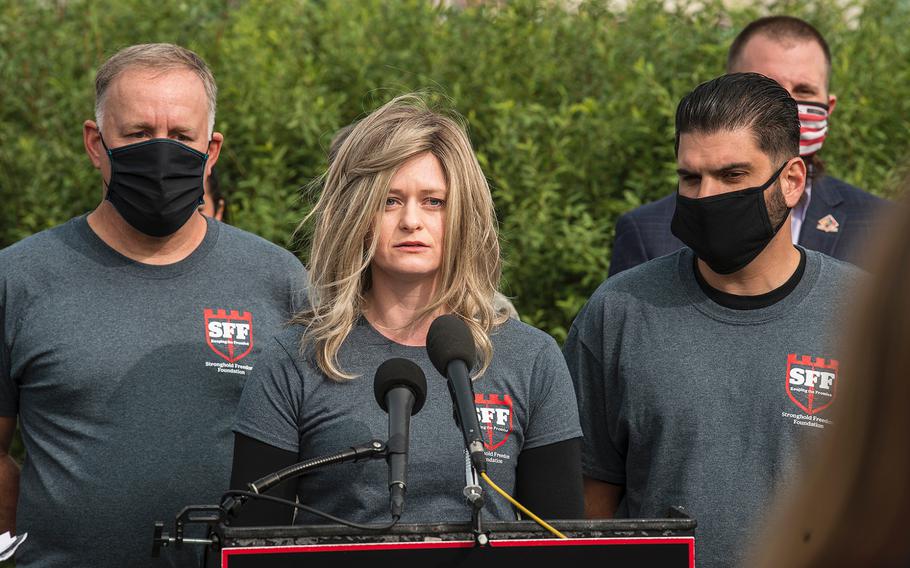 Danielle Robinson speaks in front of the U.S. Capitol in Washington on Tuesday, Sept. 15, 2020. Her late husband Sgt. 1st Class Heath Robinson was an Army medic who died in May after battling a rare cancer believed to be related to his burn pit exposure while he was deployed to Iraq.