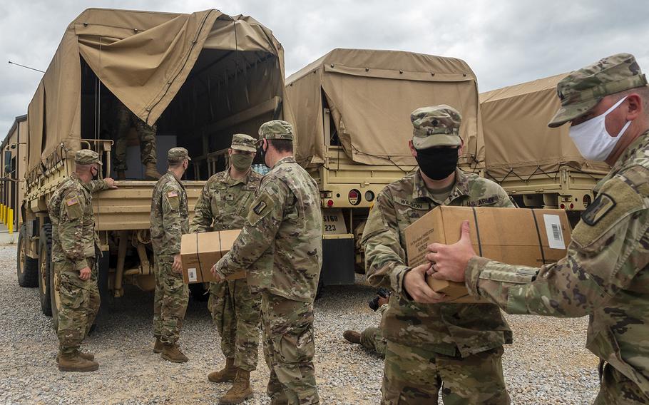 Soldiers with the Mississippi Army National Guard unload supplies at Camp Shelby Joint Forces Training Center near Hattiesburg, Miss., on Tuesday, Sept. 15, 2020, in preparation to respond to Hurricane Sally.