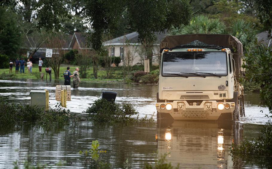 Troops from the Florida National Guard assist residents of Escambia County following Hurricane Sally on Wednesday, Sept. 16, 2020.