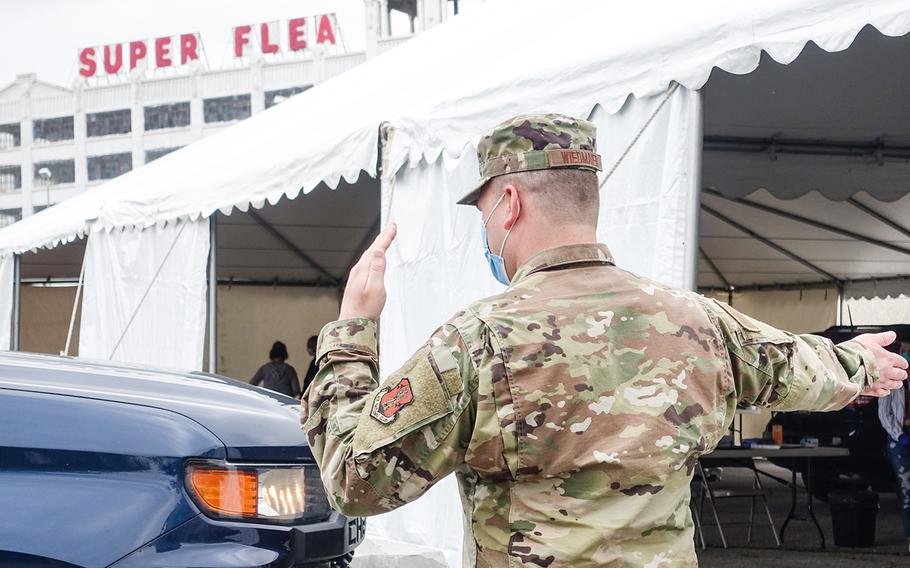Airmen assigned to the 139th Airlift Wing, Missouri Air National Guard, provide traffic management at a COVID-19 testing site in Kansas City, Mo., on May 19, 2020.